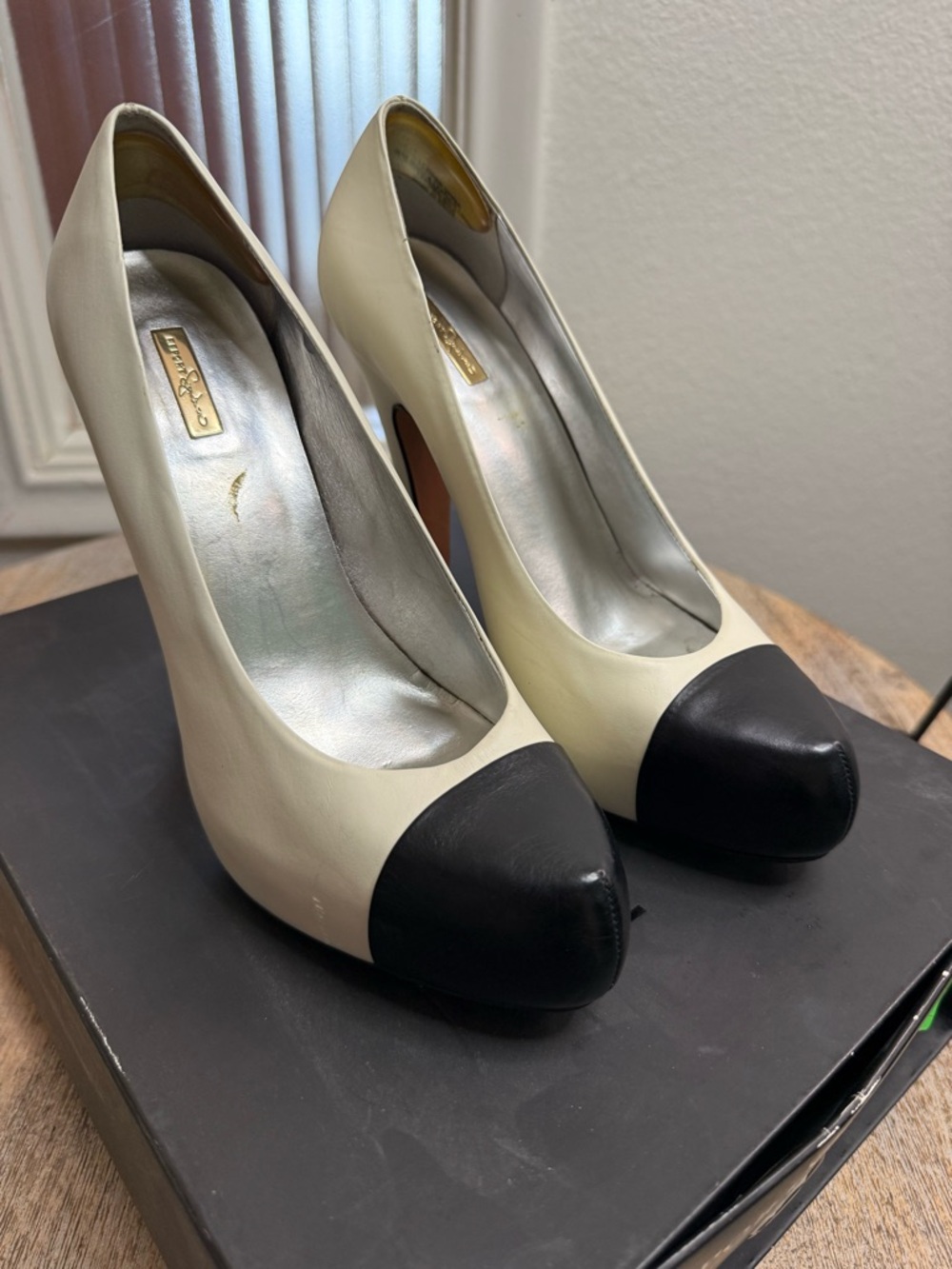 Report Signature Ivory Pumps with Black Cap Toe